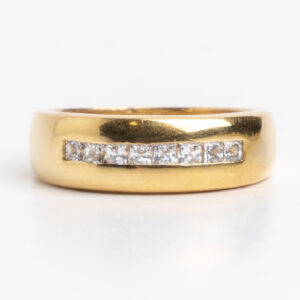 Anillo medio sin fin oro 18 kt y Zafiros blancos